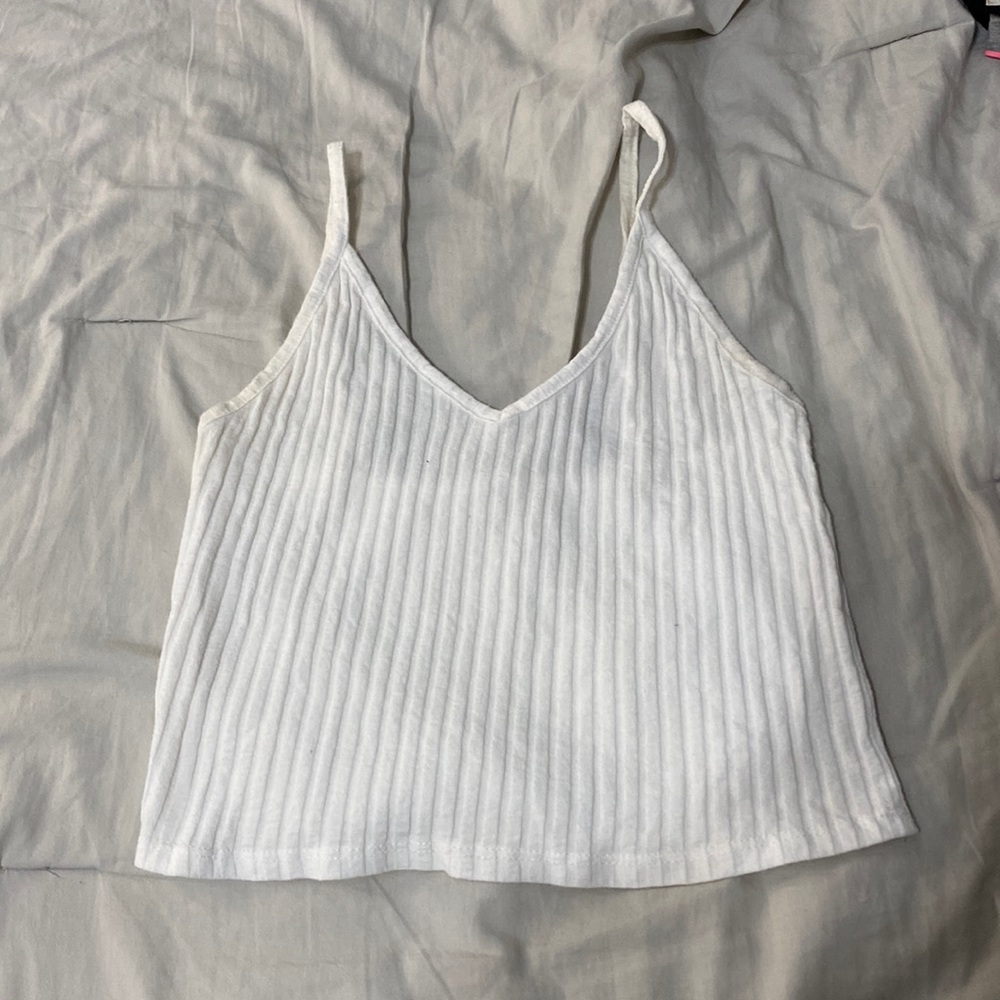 White ribbed cotton v neck tank crop. No size on tag but most likely small.